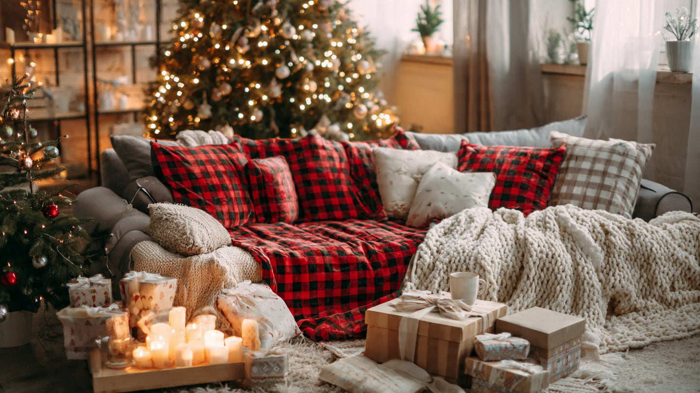 Cozy christmas living room scene with matching pajamas and tree background
